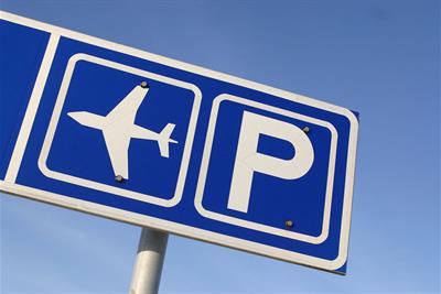 sign depicting airport parking