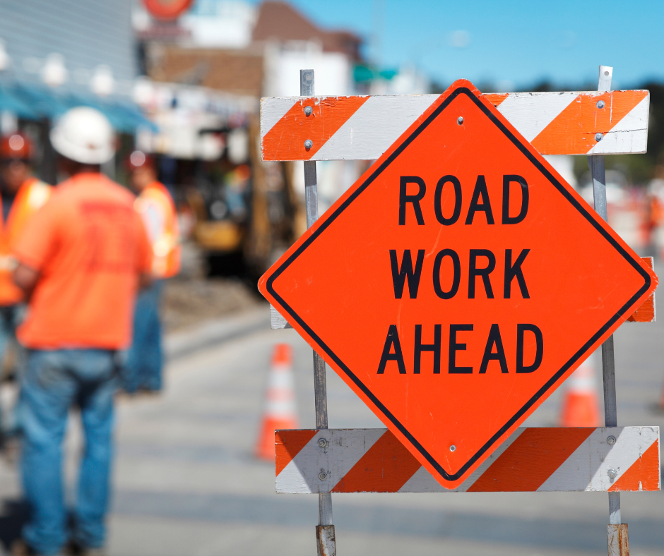 Road Work Ahead sign and workers
