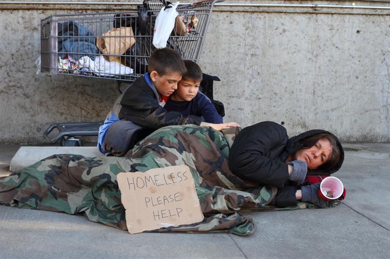 homeless family on sidewalk