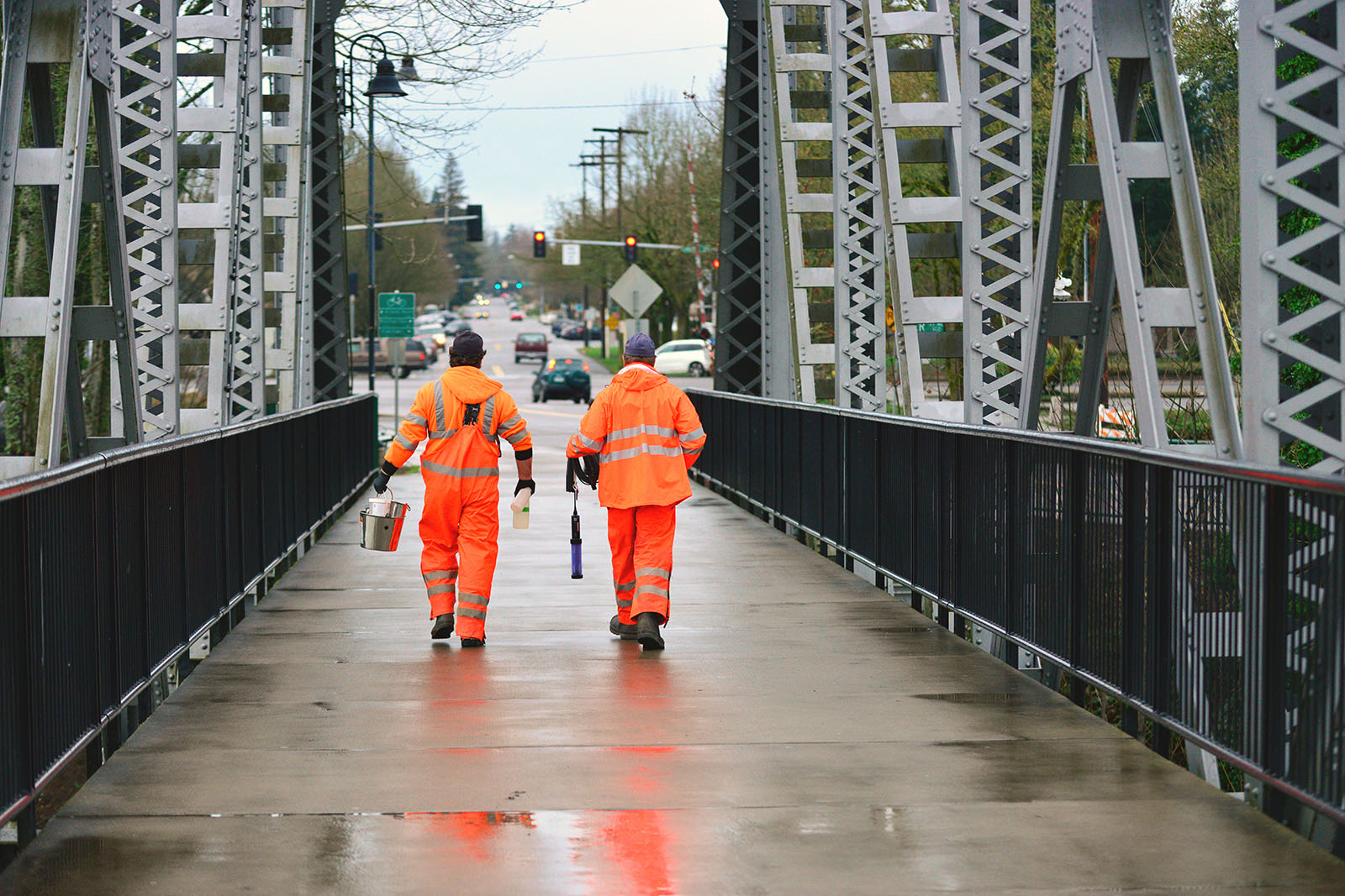 Storm crew walking over the Pedestrian Bridge