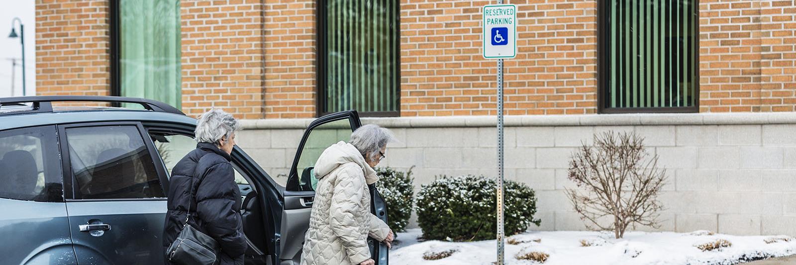 elderly women park in disabled parking spot
